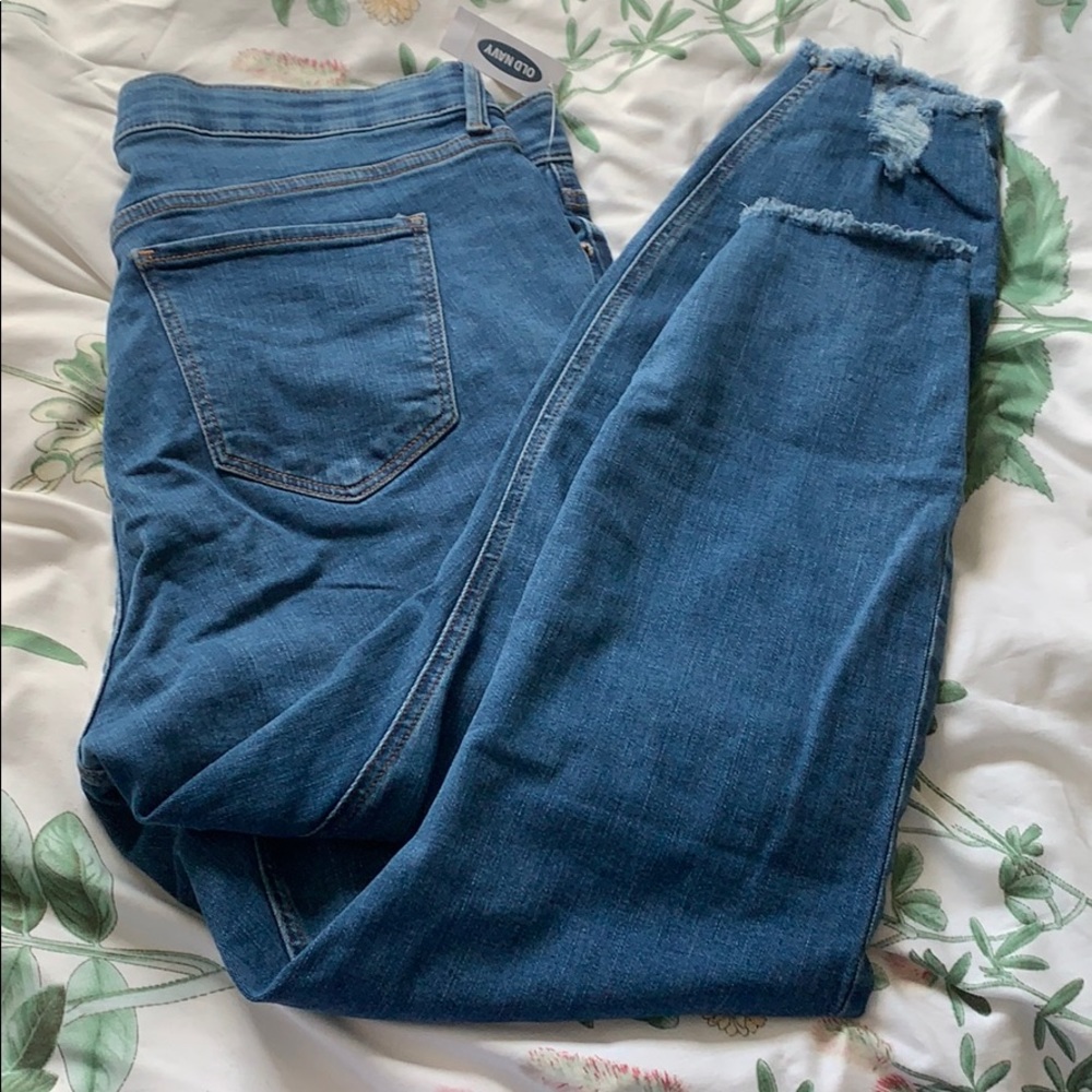 Medium wash, distressed ankle jeans.